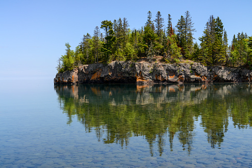 Clear reflection of island in Lake Superior, Two Harbors Minnesota.