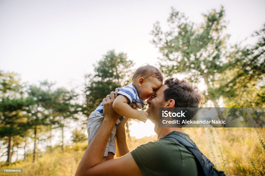 Baby boy with daddy in the nature Photo of baby boy and his daddy in the nature Family Stock Photo