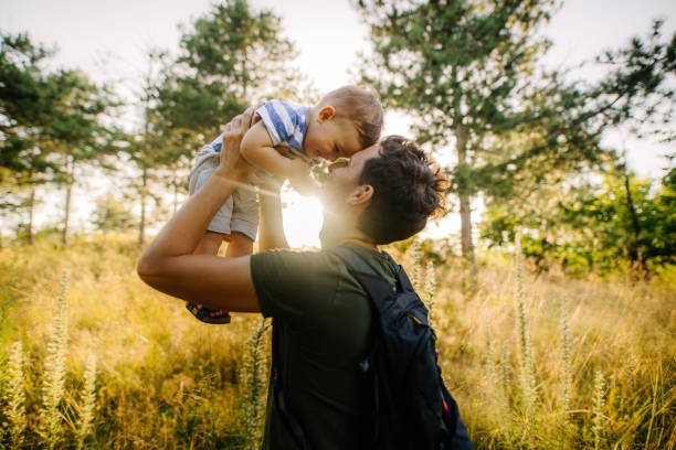 istock Baby boy with daddy in the nature 1188086472
