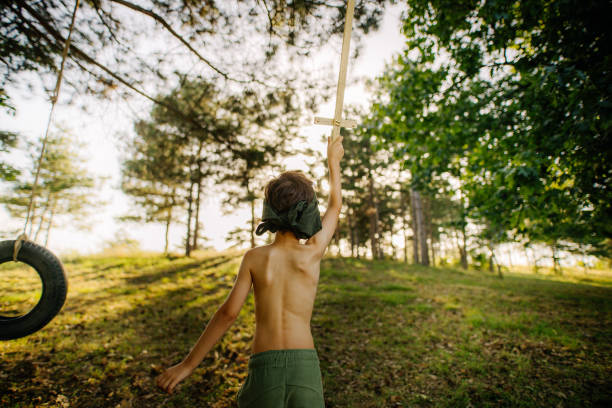 Photo of a little boy having fun in the nature