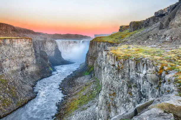 Marvelous sunrise view  of the most powerful waterfall in Europe called Dettifoss. Location: Vatnajokull National Park,  river Jokulsa a Fjollum, Northeast Iceland, Europe