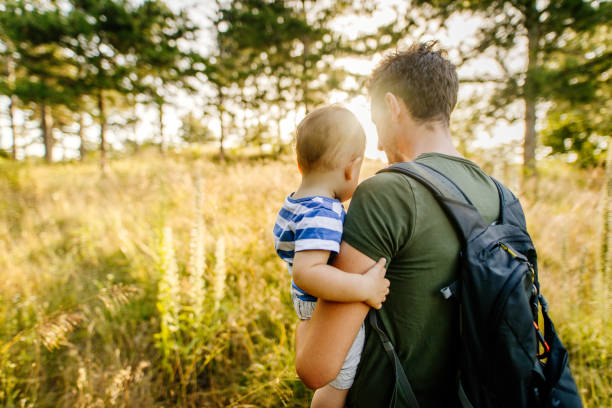 istock Baby boy with daddy in the nature 1188086573
