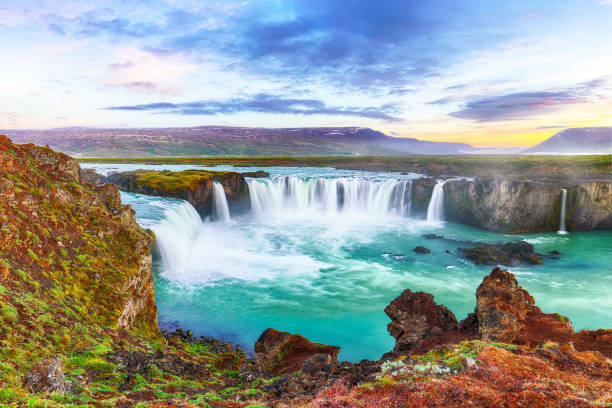 istock Dramatic sunset view of fantastic waterfall in Iceland 1188087308
