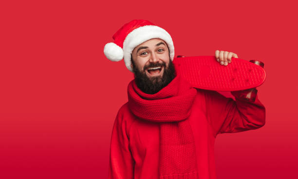 istock Hipster with skateboard celebrating Christmas 1188089287