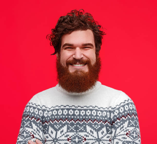 Positive bearded guy in sweater
