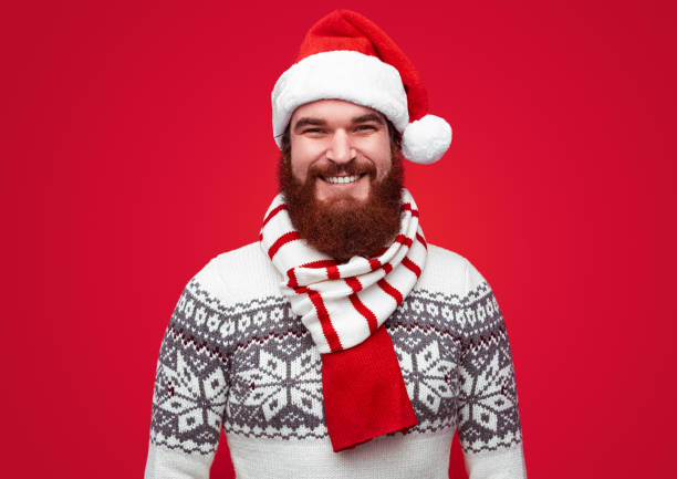 istock Happy man in Santa hat and scarf 1188089321