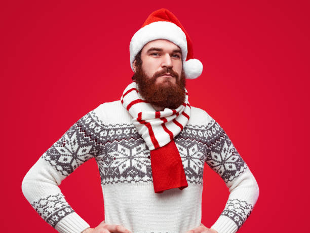 istock Serious man in Christmas hat 1188089329