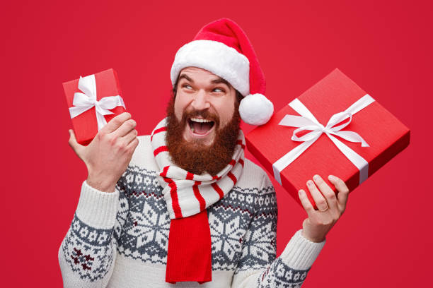 istock Delighted man with Christmas gifts 1188089341