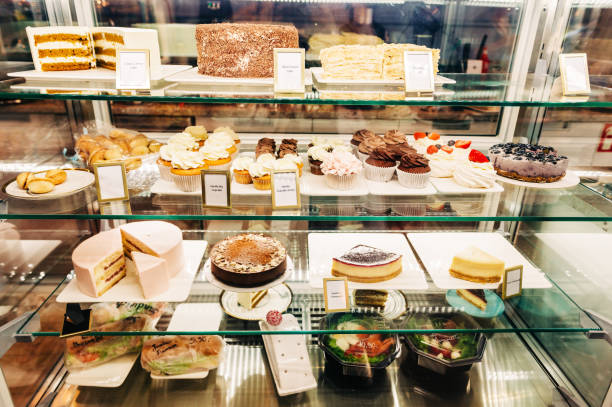 istock Counter with different kind of cakes, cupcakes and fresh salads 1188093328