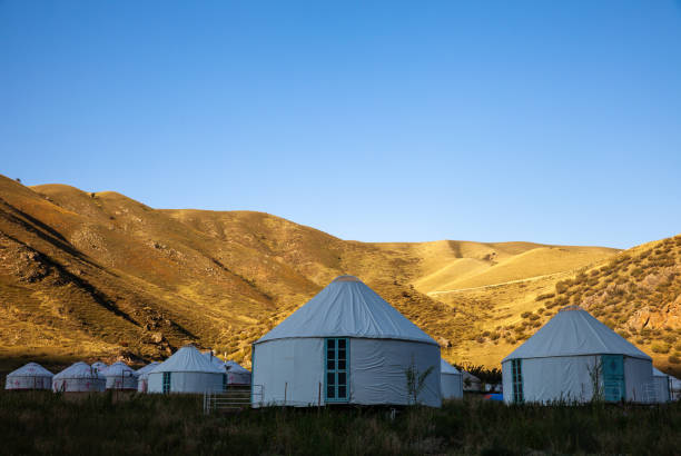 istock Mongolian yurts under the mountain 1188094259