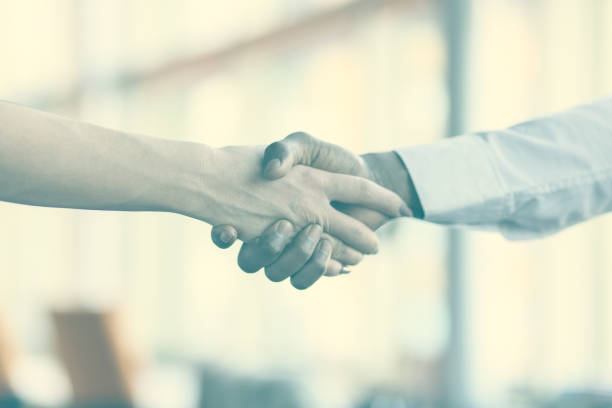istock Handshake between african and a caucasian man. 1188095706