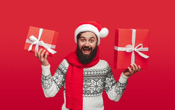 istock Excited hipster showing Christmas presents 1188101113
