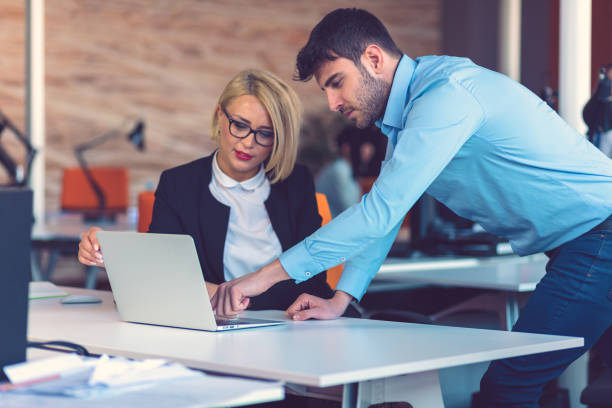 istock Happy business partners working on laptop. Teamwork, co-working concepts. 1188102693
