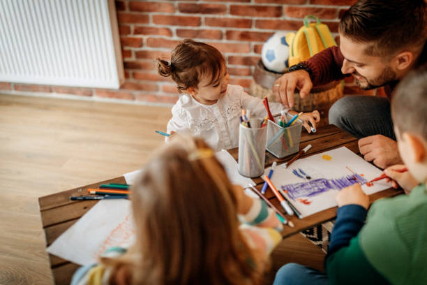 istock Father teaching kids to draw 1188115844