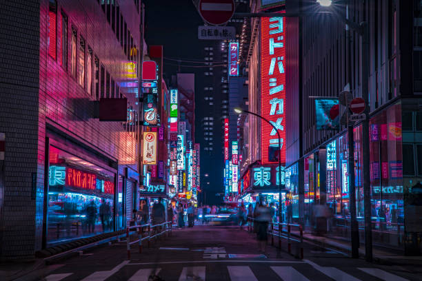 A night of the neon street at the downtown in Shinjuku Tokyo wide shot A night of the neon street at the downtown wide shot. Shinjuku district Tokyo / Japan - 08.29.2019 It is a famous town in Shinjuku. It's called SHIBUYA crossing. We can see many people & neon billboard. alley photos stock pictures, royalty-free photos & images