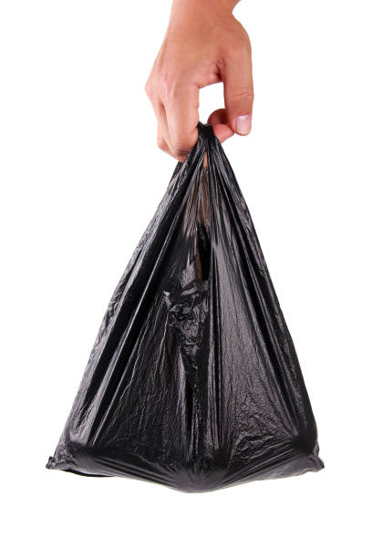 istock Male hand holding plastic bag on white background 1188121623