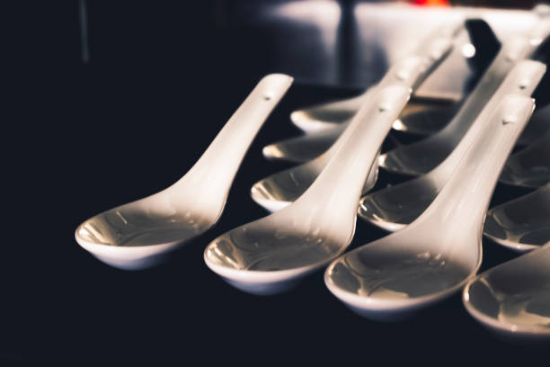 Abstract background of sparkling white spoon on reflection surface. selective focus shot