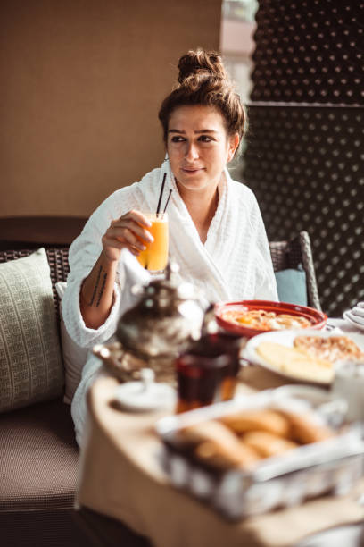 istock woman at the table for the buffet breakfast with fruit 1188144937