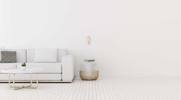 istock View of living room space with sofa and round side table on white wall and bright laminate floor.Perspective of minimal Interior design with gold lamp. 3d rendering. 1188149742