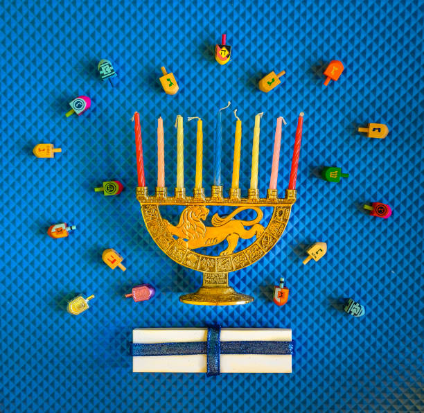 istock Menorah, presents and dresidels for Hanukkah arranged as flat lay 1188150465