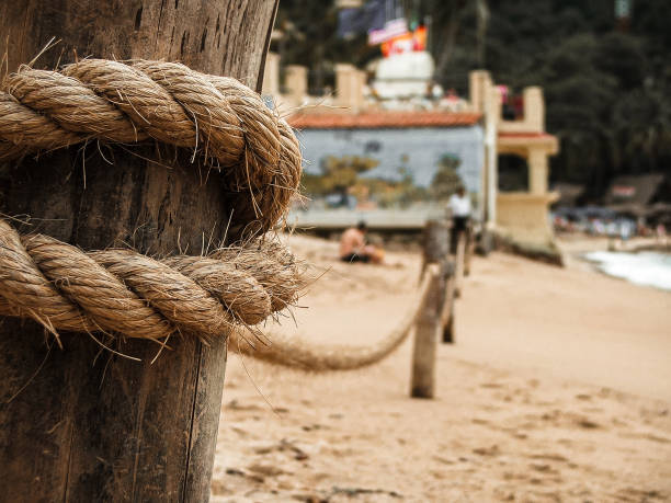 Fence with ropes in the sand at the beach