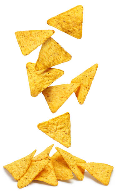 Falling nachos chips on white Falling delicious mexican nachos chips, isolated on white background fried potato stock pictures, royalty-free photos & images