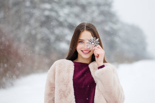 Woman holding a snowflake