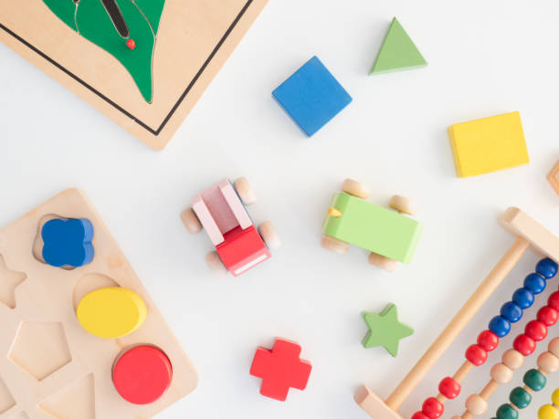istock kids learning concept with stacking toys on blue table background. 1188161372