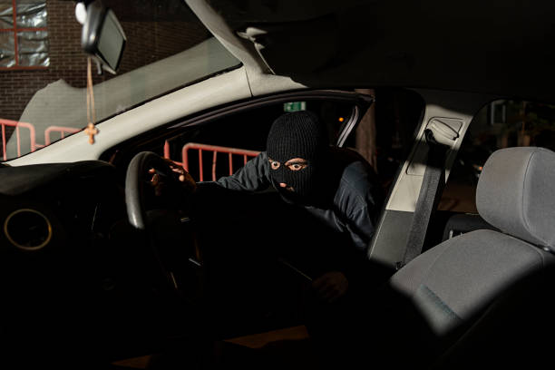 istock Thief is Trying to Hijack the Car During a Night 1188165966