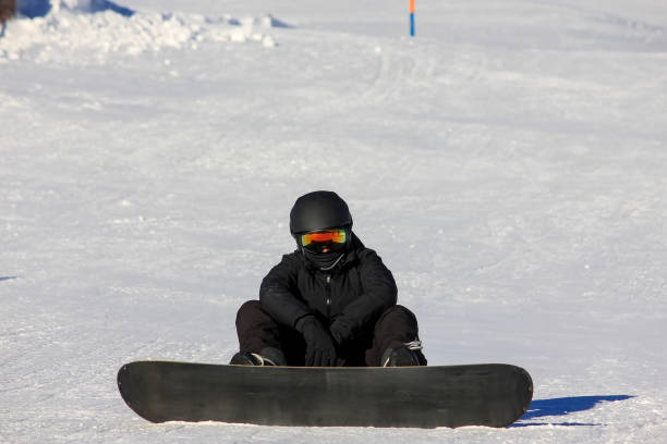 istock Snowboarding girl on the mountain slope 1188166236