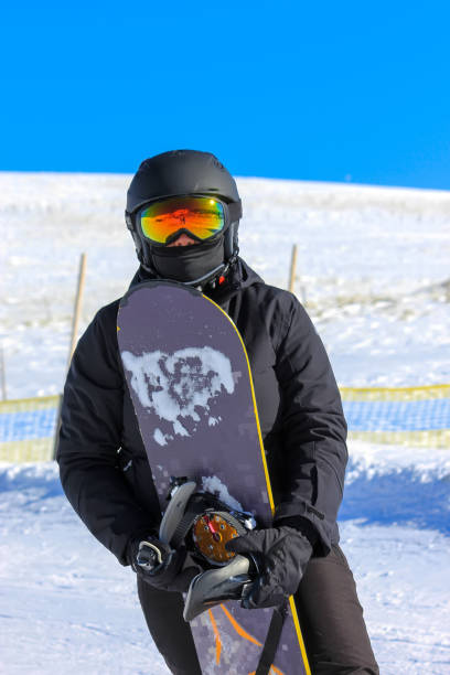 istock Snowboarding girl on the mountain slope 1188166948