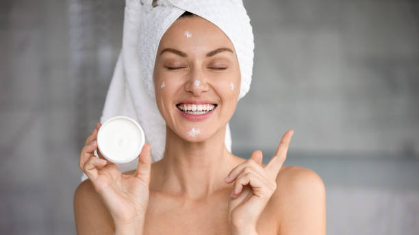 istock Funny attractive woman hold cream jar point at copy space 1188167209