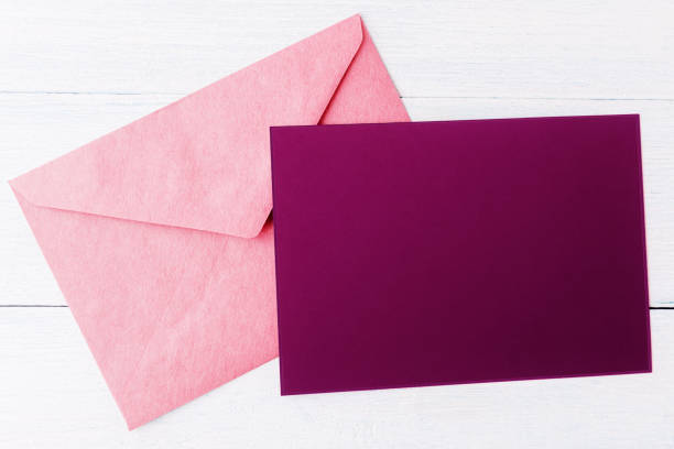 istock Viole blank card and envelope over white wooden background 1188168149