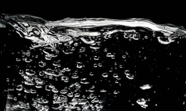 istock Clear water surface on a black with ripple and bubbles 1188168452