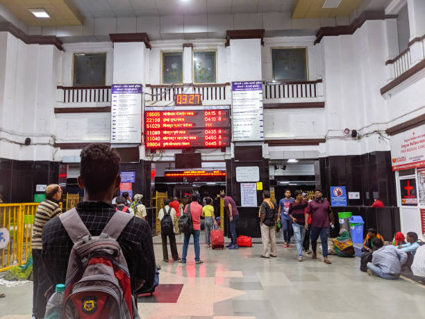Indian Railway station scene Pune, India: Passengers checking train status on information board at Pune railway station entrance hall in Pune, India.
Indian Railways, India's national railway system, 4th in size in all over world, is most popular transport system used all over India for long and short distance travels. india airport stock pictures, royalty-free photos & images