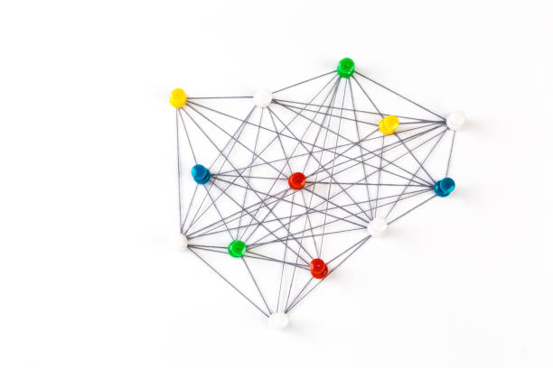 istock Network connection made from push pins and thread on blue background, close-up. 1188170019