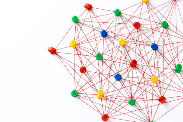 istock Network connection made from push pins and thread on blue background, close-up. 1188170042