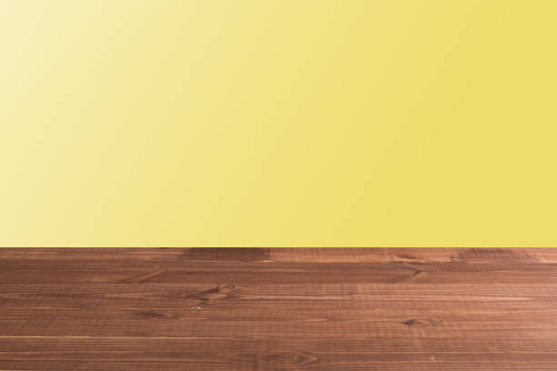 istock Wooden board empty table in front of a blurred background. Perspective brown wood with a blurry multi-colored background - can be used to showcase or assemble your products. 1188170698
