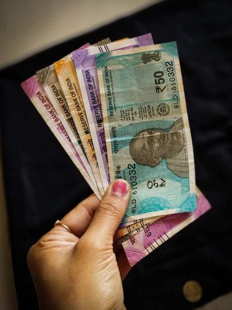 istock INDIAN CURRENCY IN BLACK BACKGROUND 1188170898