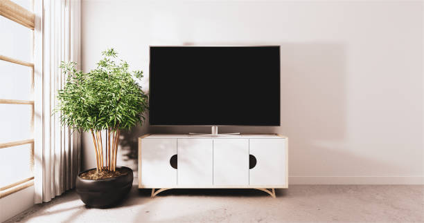 istock Smart Tv led on cabinet design, Minimal room mock up white wall background.3D rendering 1188171344