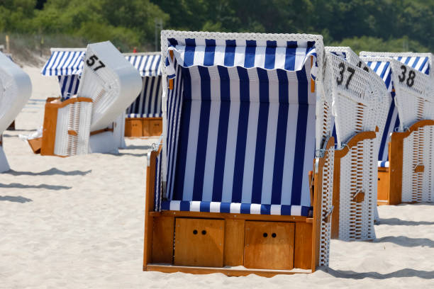 istock Roofed wicker beach chairs is on a beach 1188172069