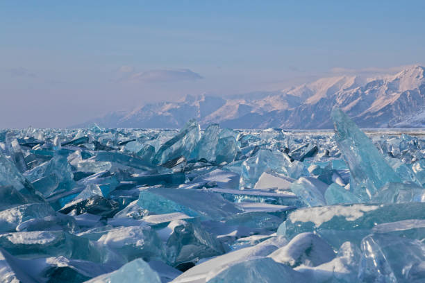 istock Luminous blue broken ice blocks on mountains background 1188172388