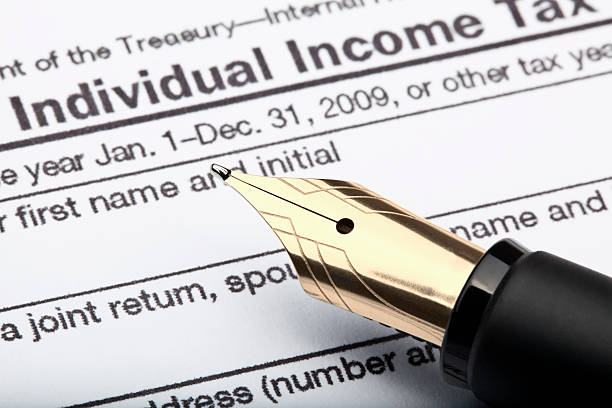 istock pen and tax form 118817240