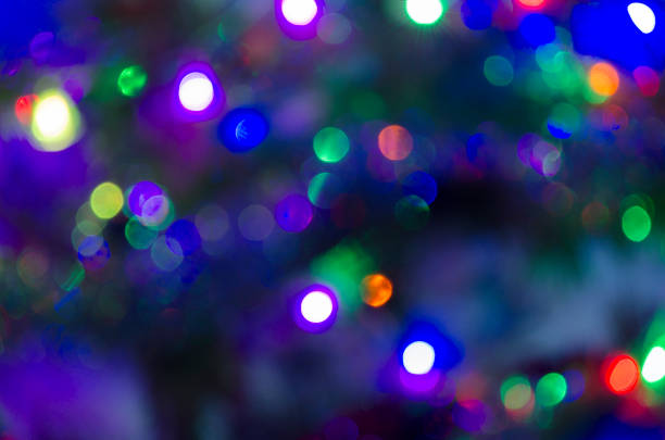 istock Christmas background with light spots and bokeh. Abstract background. Night background with bright lights 1188174038