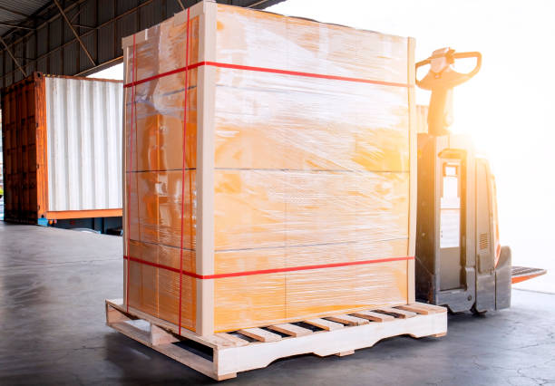 istock Electric forklift pallet jack with shipment goods pallet 1188174129