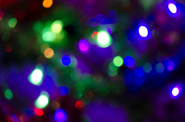 istock Christmas background with light spots and bokeh. Abstract background. Night background with bright lights 1188174157
