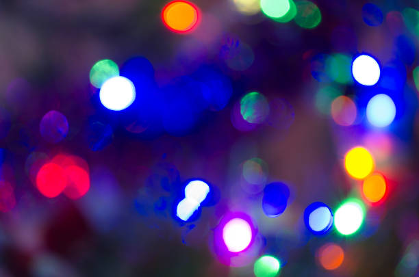 istock Christmas background with light spots and bokeh. Abstract background. Night background with bright lights 1188174669