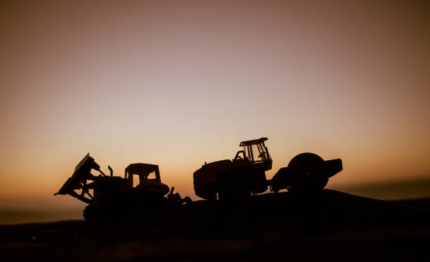 istock Abstract Industrial background with construction crane silhouette over amazing sunset sky. Mobile crane against the evening sky. Industrial skyline. Selective focus 1188174854