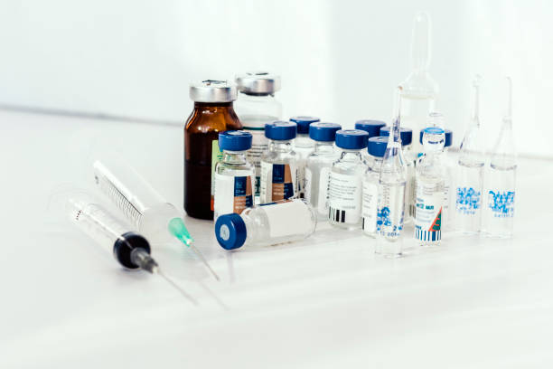 istock Medicine bottles, ampules, on white background with copy space for text, treatment medication concept closeup 1188174931