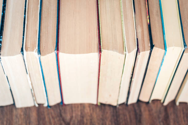 istock stack of old book education concept background, many books piles with copy space for text 1188174934